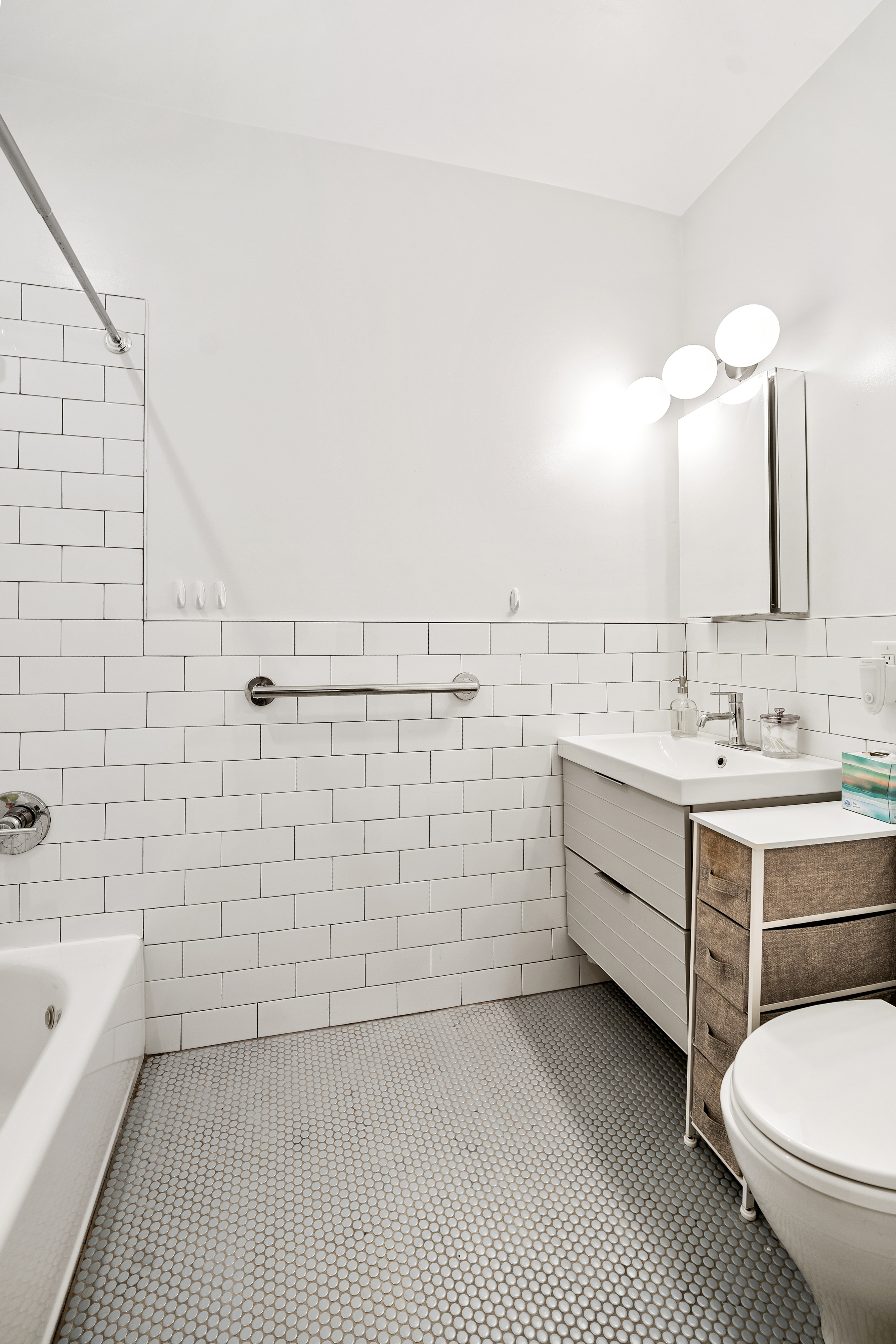 353 12th Street, Unit 2 Brooklyn, NY 11215 - Photo 7 of 17 a bathroom with a sink a toilet and shower