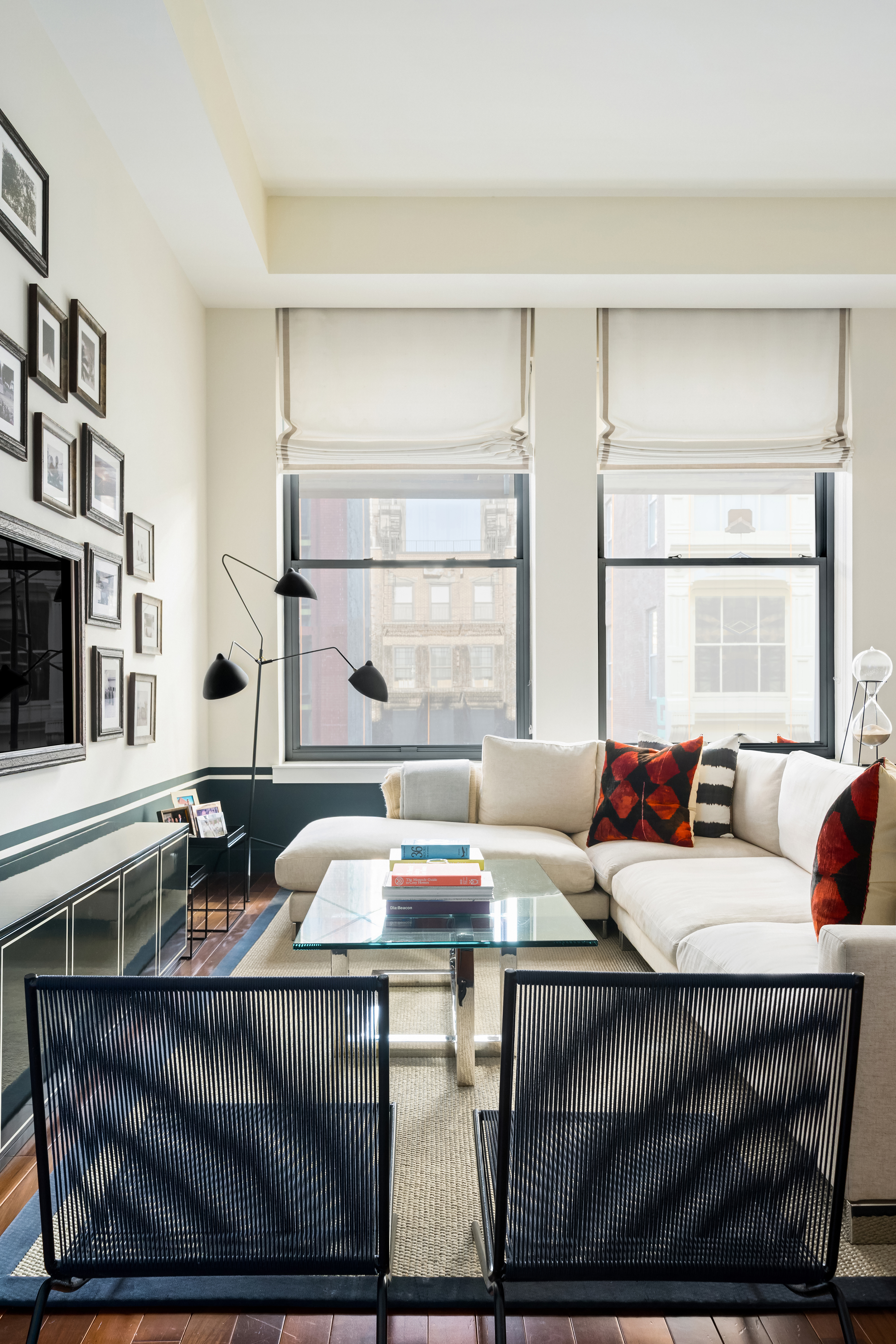 92 Greene Street, Unit 3B Manhattan, NY 10012 - Photo 2 of 8 a living room with furniture and a window
