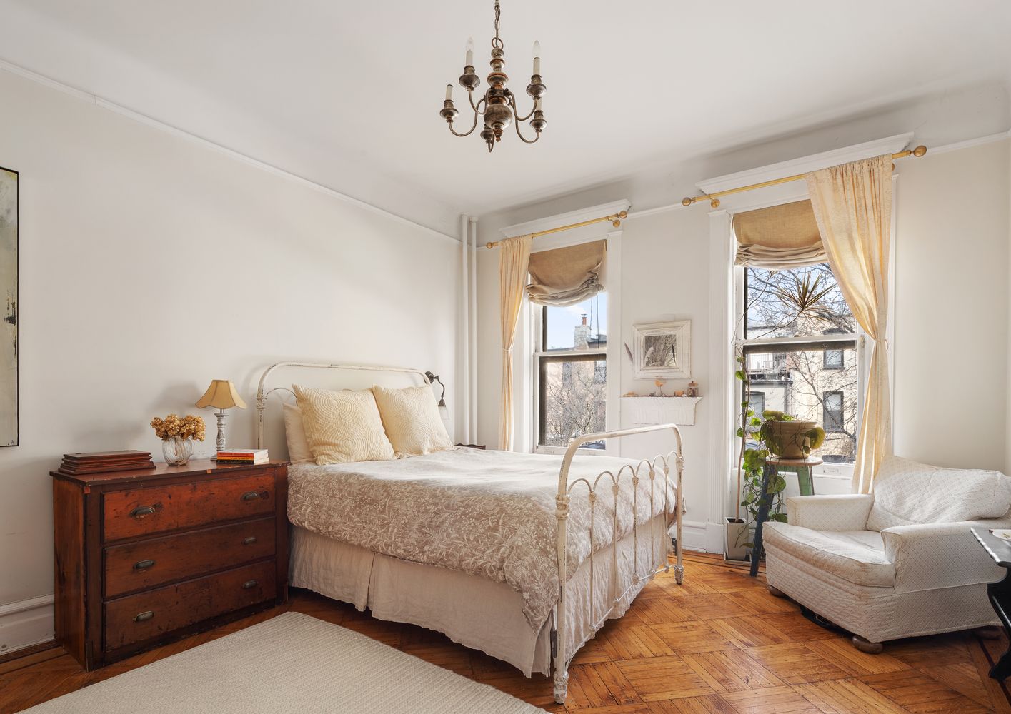 a bedroom with a large bed and a couch