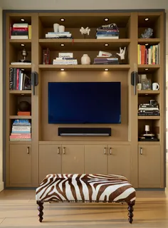 a bedroom with a bed and flat screen tv