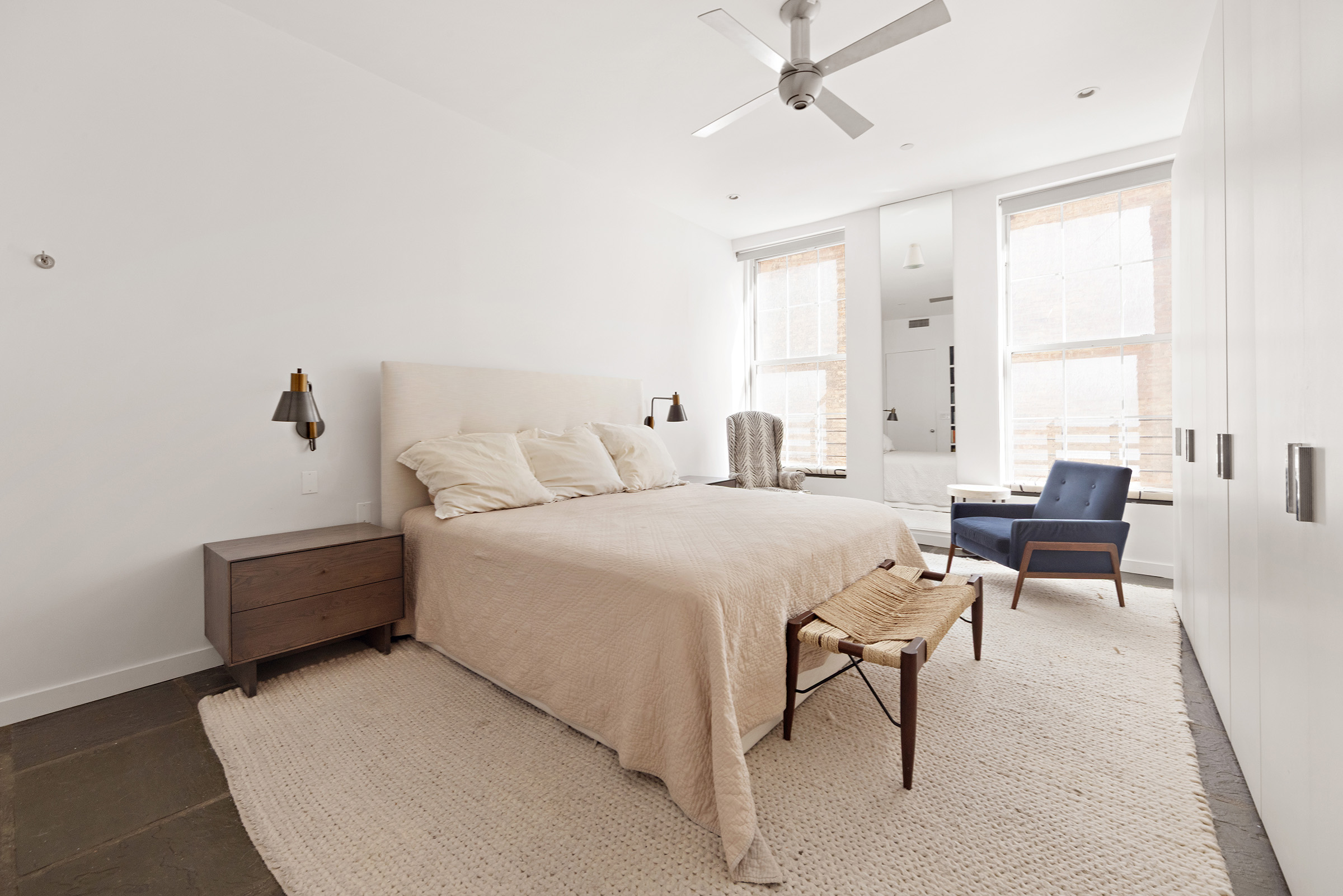 25 Leonard Street, Unit 2 New York, NY 10013 - Photo 5 of 12 a bedroom with a bed and a couch