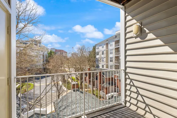 a view of balcony with furniture