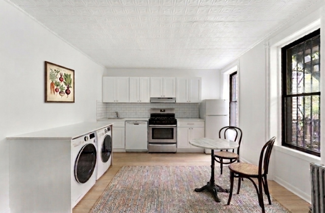 281 6th Street, Unit 1 Brooklyn, NY 11215 - Photo 1 of 7 a kitchen with a stove top oven sink and a window