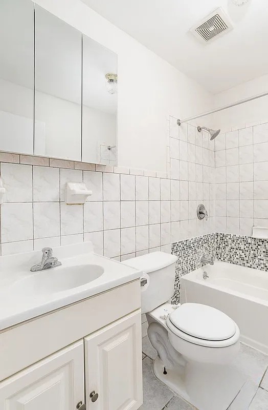 224 Cumberland Street, Unit 4 Brooklyn, NY 11205 - Photo 5 of 5 a bathroom with a sink a toilet and shower