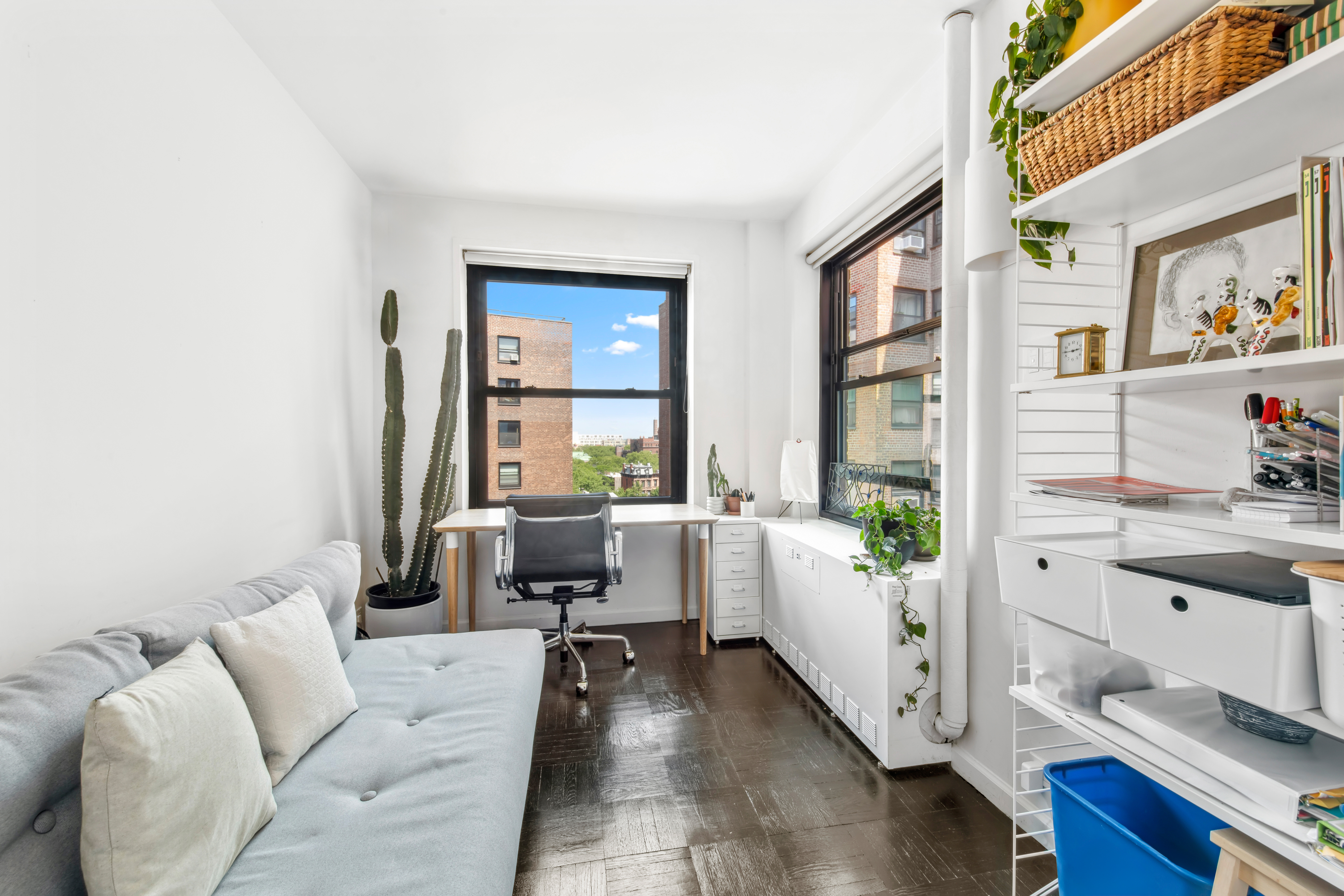 201 Clinton Avenue, Unit 10F Brooklyn, NY 11205 - Photo 6 of 11 a living room with furniture and a window