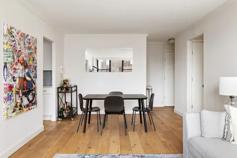 a view of a livingroom with furniture and wooden floor