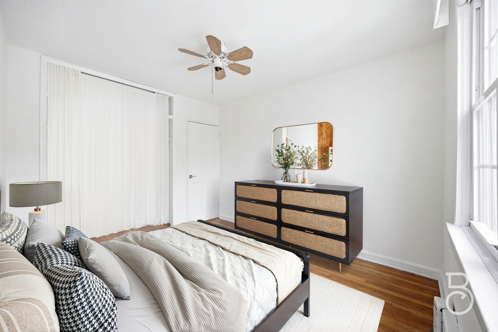 22-61 46th Street Queens, NY 11105 - Photo 7 of 24 a bedroom with a bed and a window