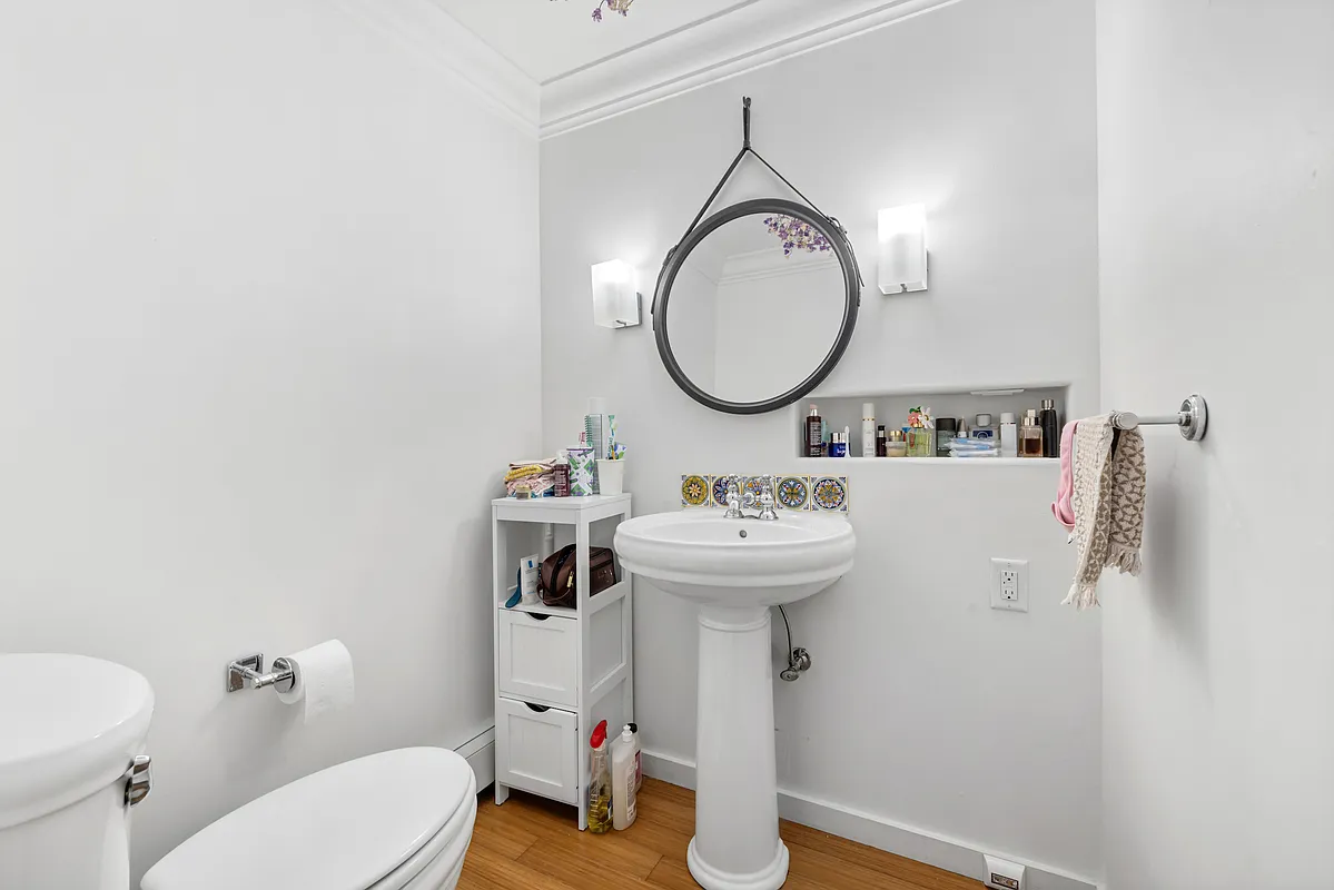 155 Luquer Street, Unit 1 Brooklyn, NY 11231 - Photo 11 of 13 a bathroom with a sink and a mirror