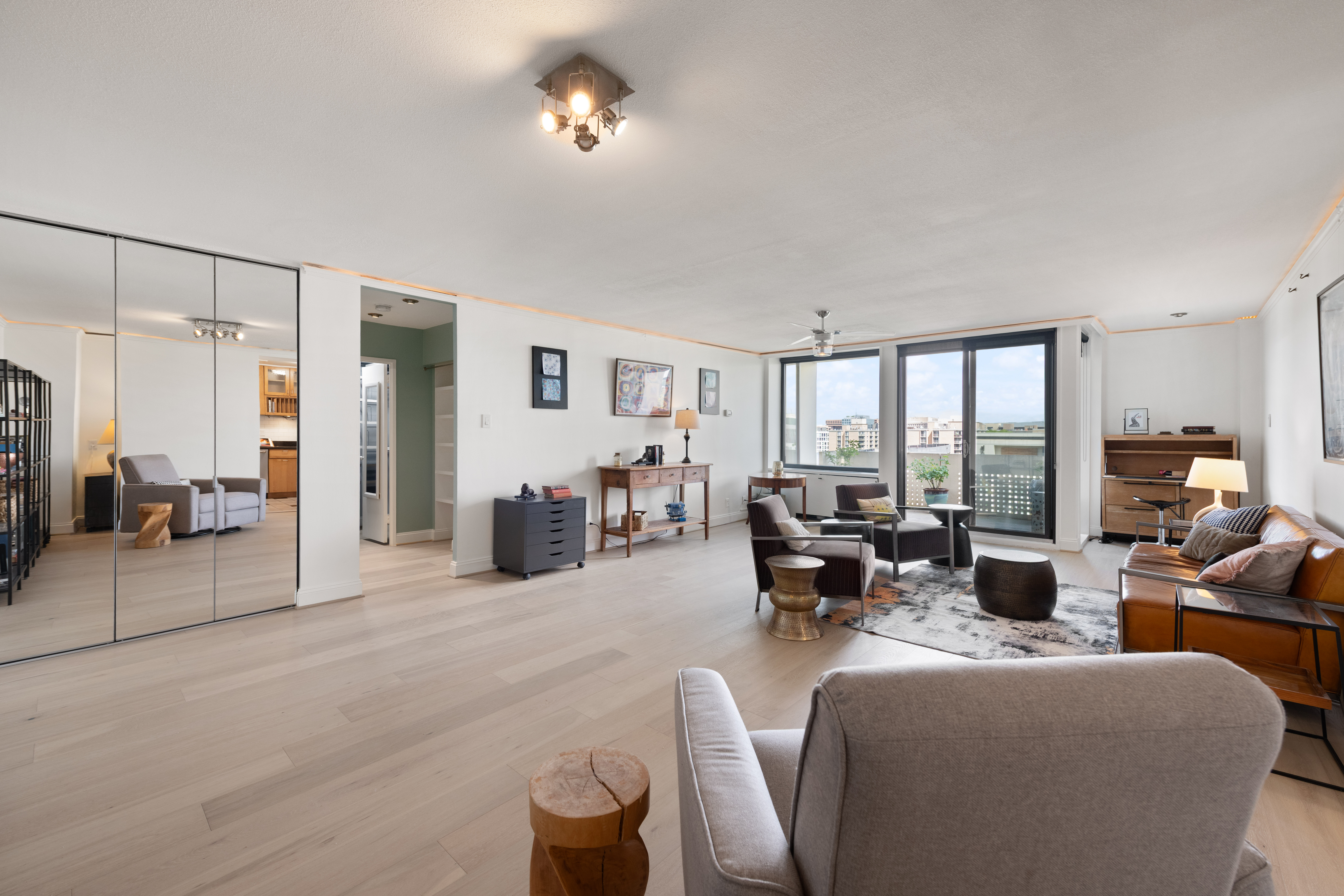 490 M Street Southwest, Unit W802 Washington, DC 20024 - Photo 7 of 24 a living room with furniture and large windows