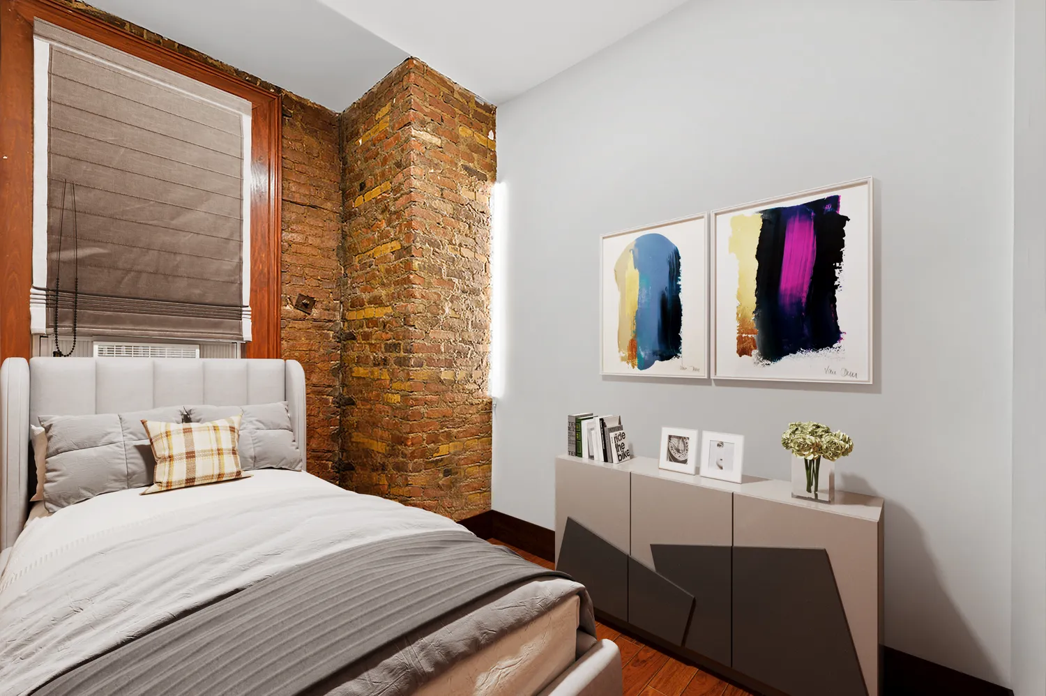 a bedroom with a bed and a mirror next to a window