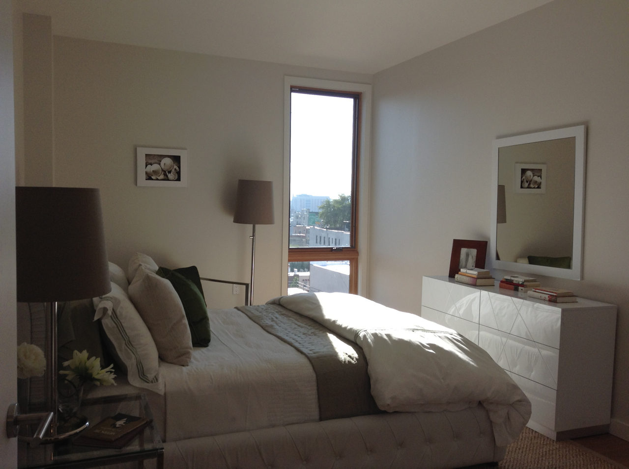 548 4th Avenue, Unit 8A Brooklyn, NY 11215 - Photo 19 of 21 a bedroom with a bed and flat tv screen on the dresser