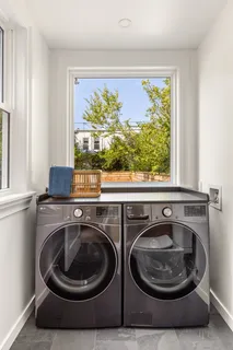 a view of a washer and dryer near a window