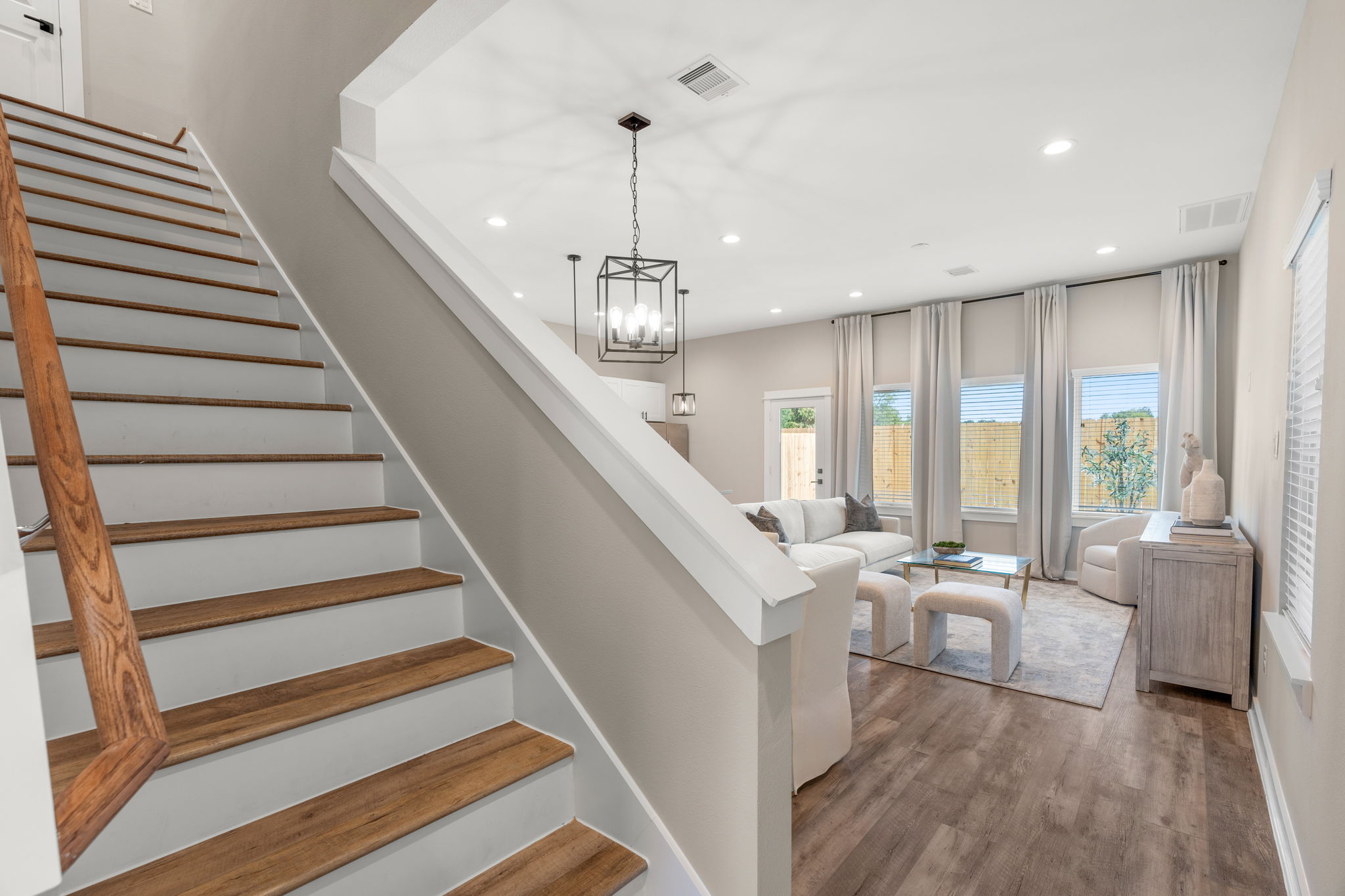 11303 Stonework Grv Lane Houston, TX 77076 - Photo 14 of 39 a living room with furniture and stairs