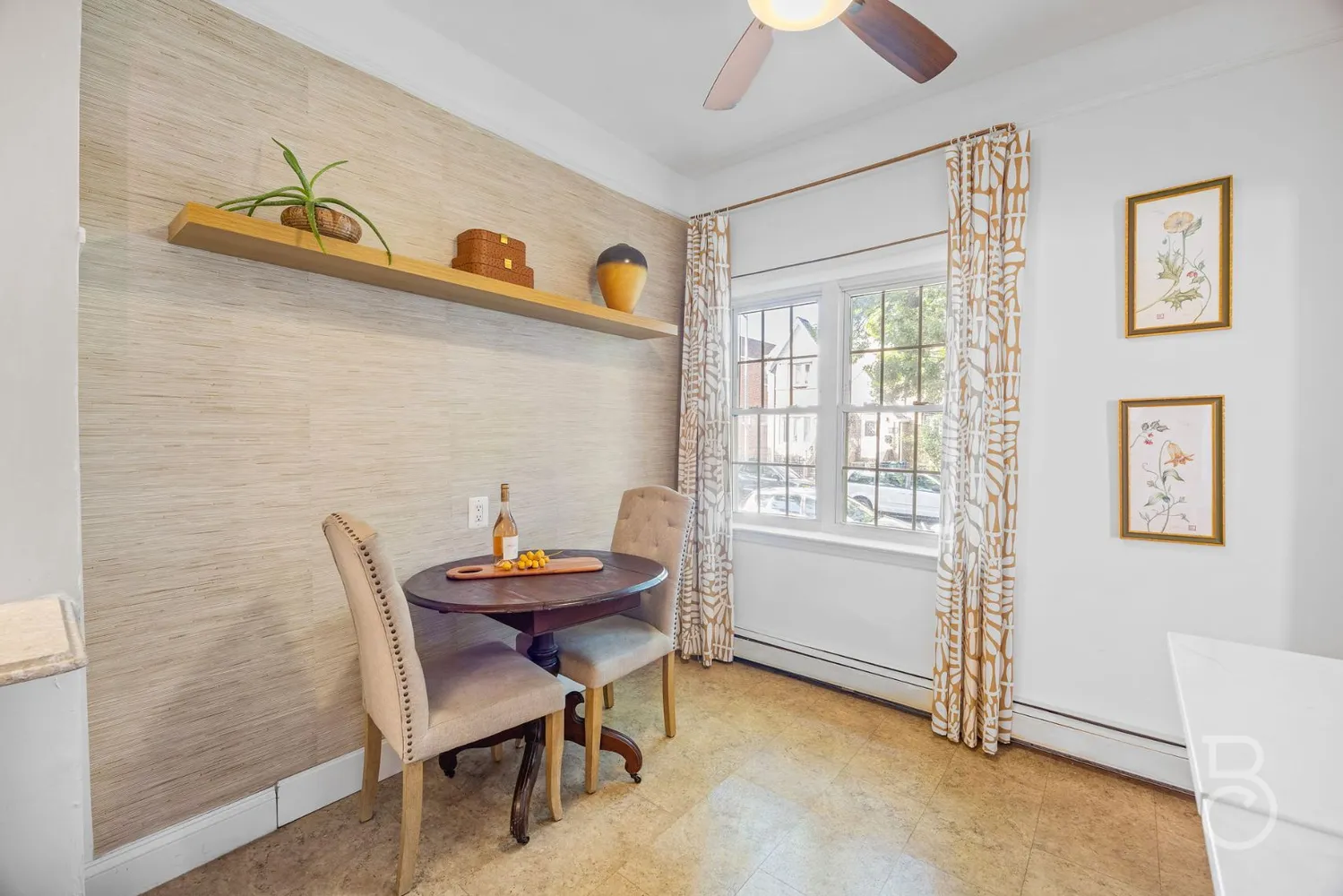 a dining room with furniture and window