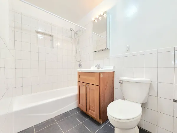 a bathroom with a toilet a sink and bathtub