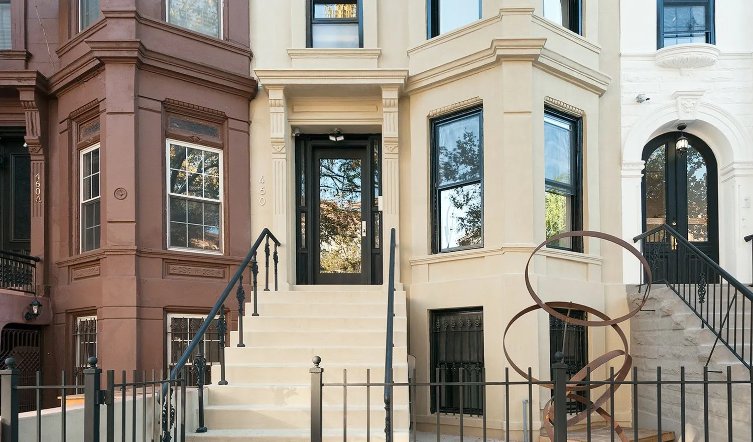 front view of a brick house with a large windows