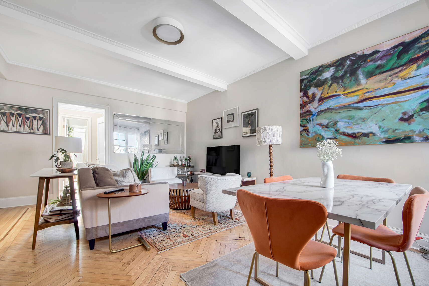 a living room with fireplace furniture and a wooden floor
