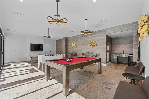 a bedroom with bed and flat screen tv