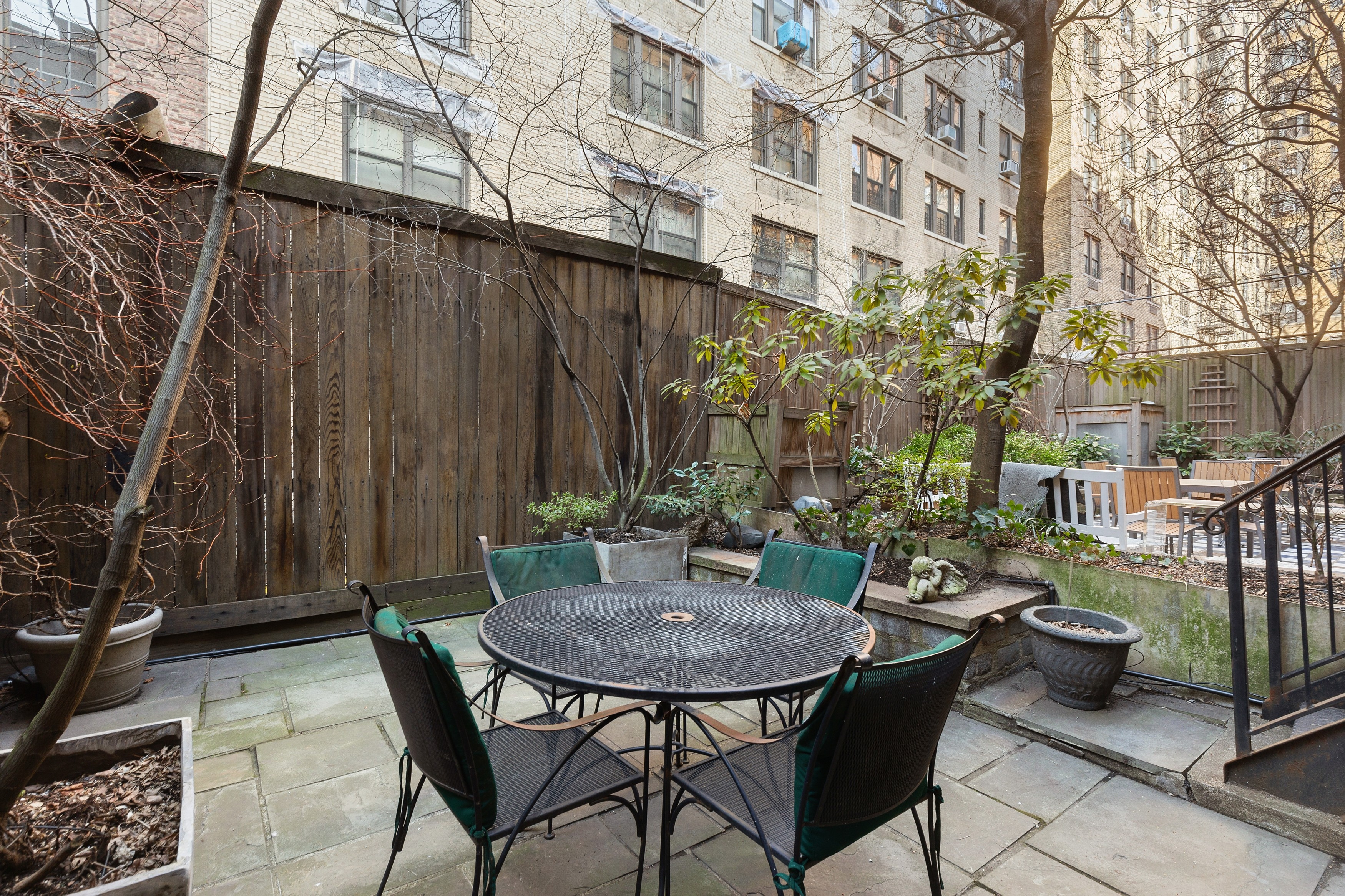 333 West 71st Street Manhattan, NY 10023 - Photo 27 of 29 a view of a patio with a table and chairs and potted plants