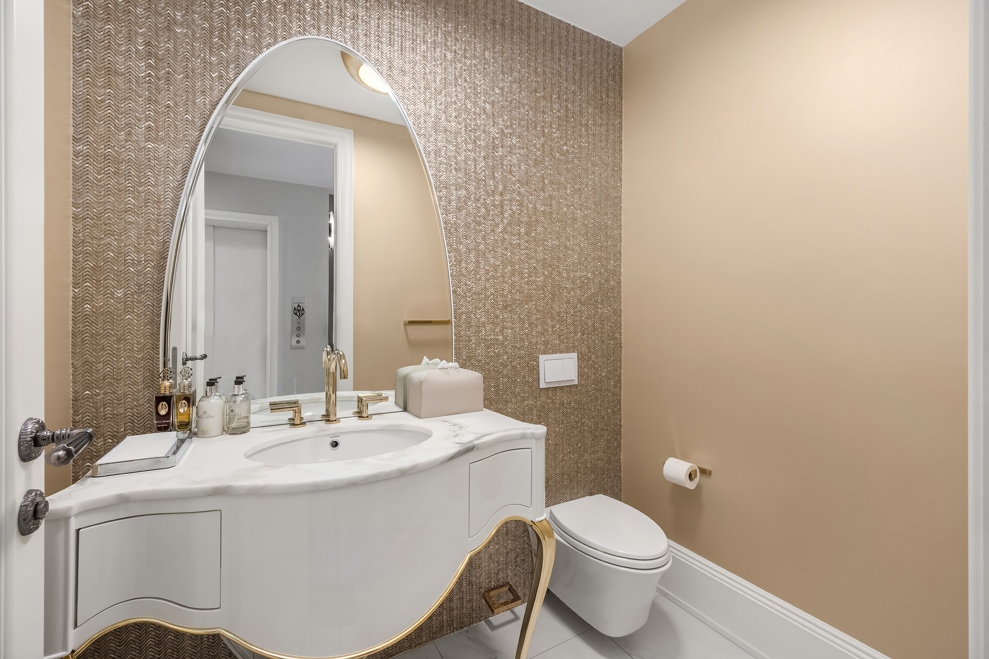 123 East 61st Street Manhattan, NY 10065 - Photo 26 of 31 a bathroom with a toilet sink and mirror