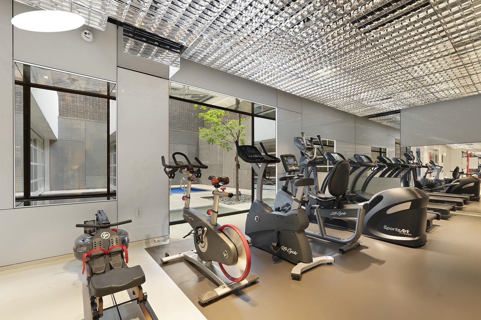 100 11th Avenue, Unit 9D Manhattan, NY 10011 - Photo 11 of 17 a view of a room with gym equipment