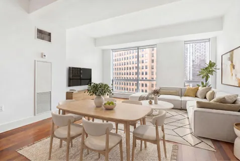 a dining room with furniture and window