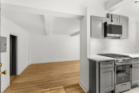 a kitchen with a stove and a microwave