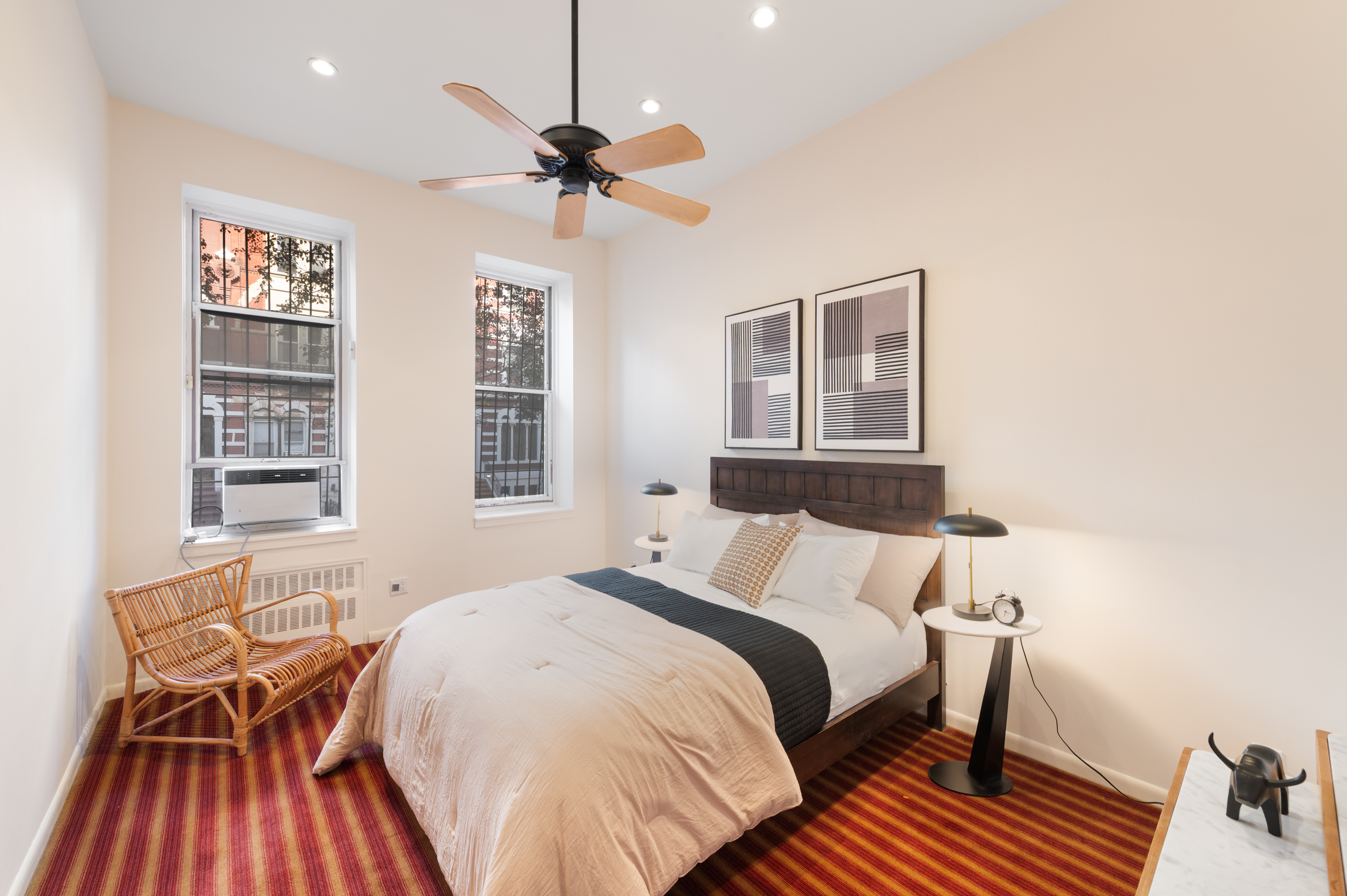 126 West 78th Street Manhattan, NY 10024 - Photo 16 of 39 a bedroom with a bed and wooden floor