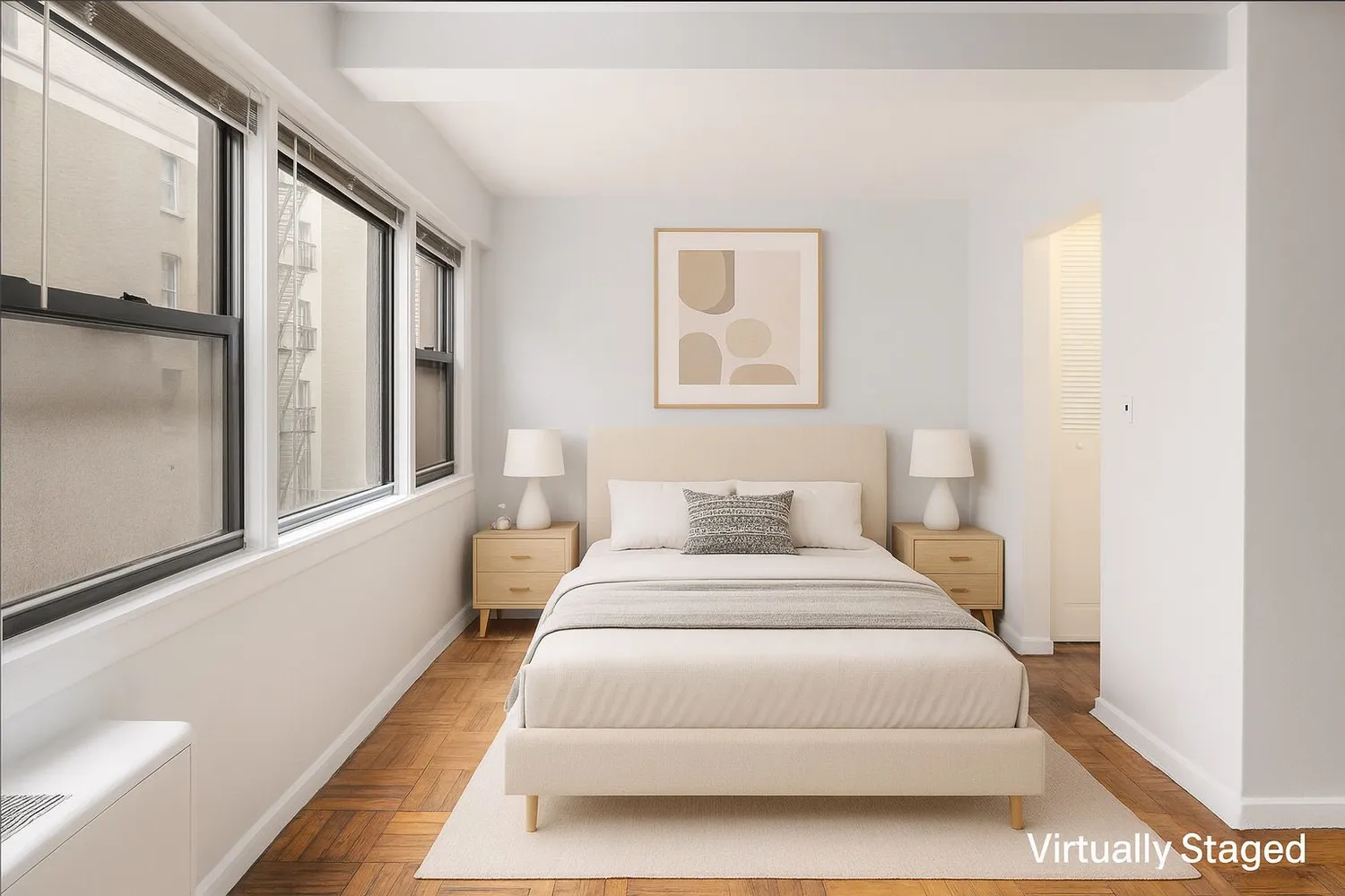 a bedroom with a large bed and a large window