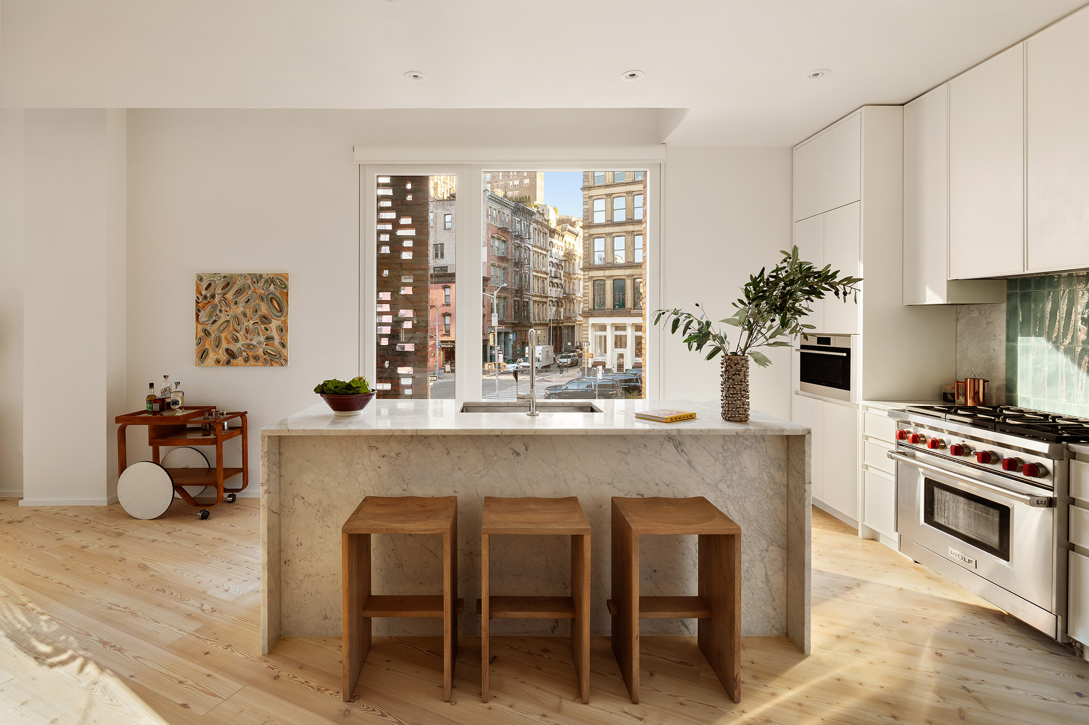 1 Avenue Of The Americas, Unit 2N Manhattan, NY 10013 - Photo 5 of 15 a kitchen with a table and chairs in it