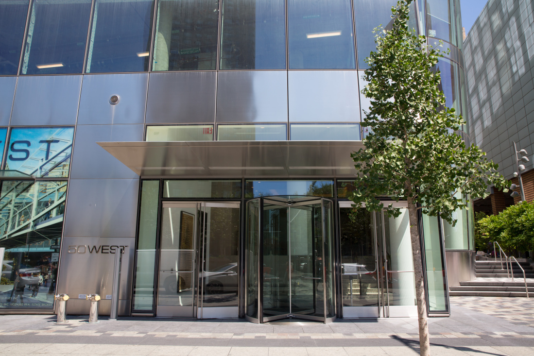 50 West Street, Unit 14B Manhattan, NY 10006 - Photo 28 of 29 a building with trees in front of it