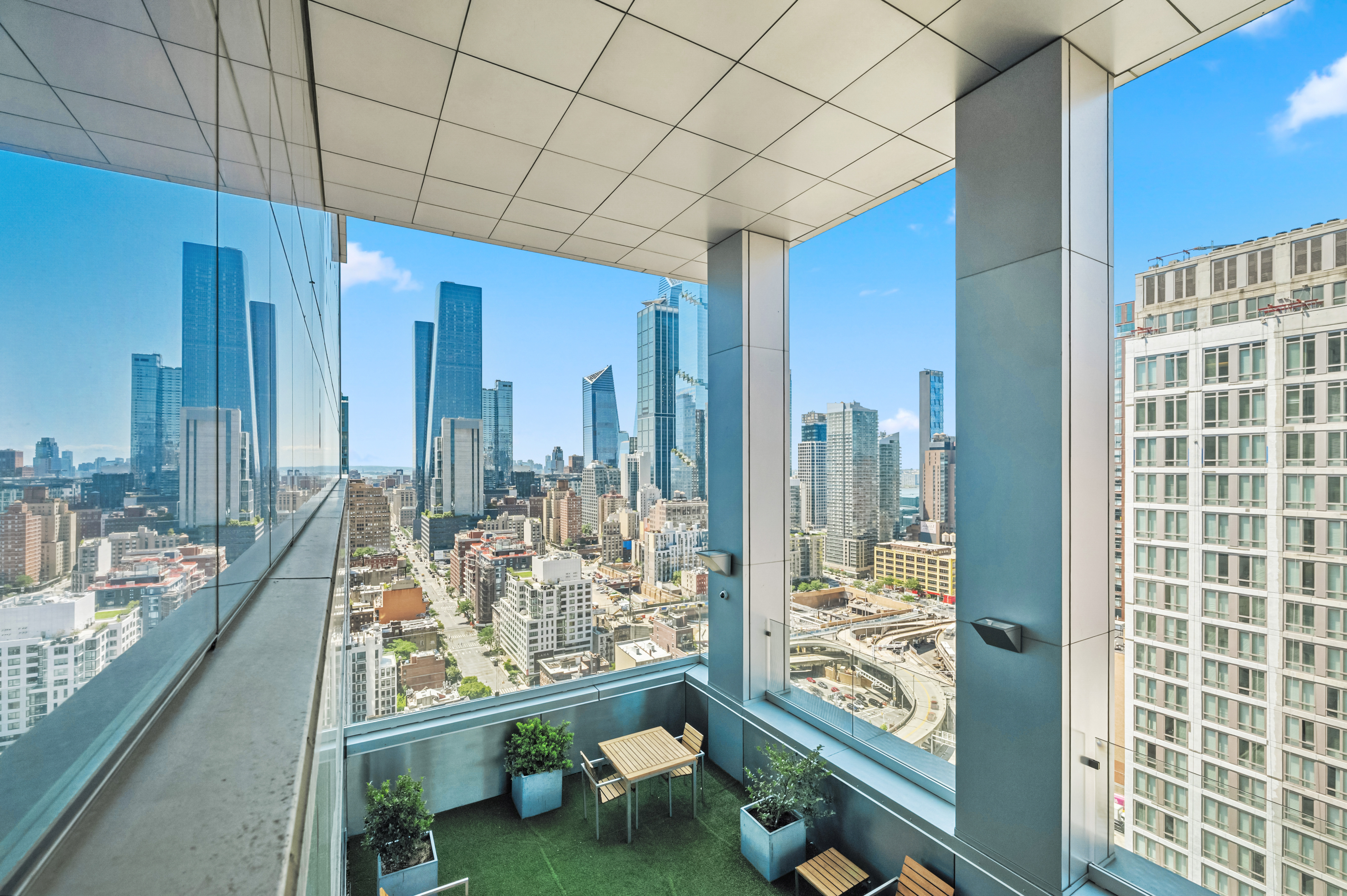 350 West 42nd Street, Unit 6K Manhattan, NY 10036 - Photo 8 of 13 a room with water heater and a wooden floor