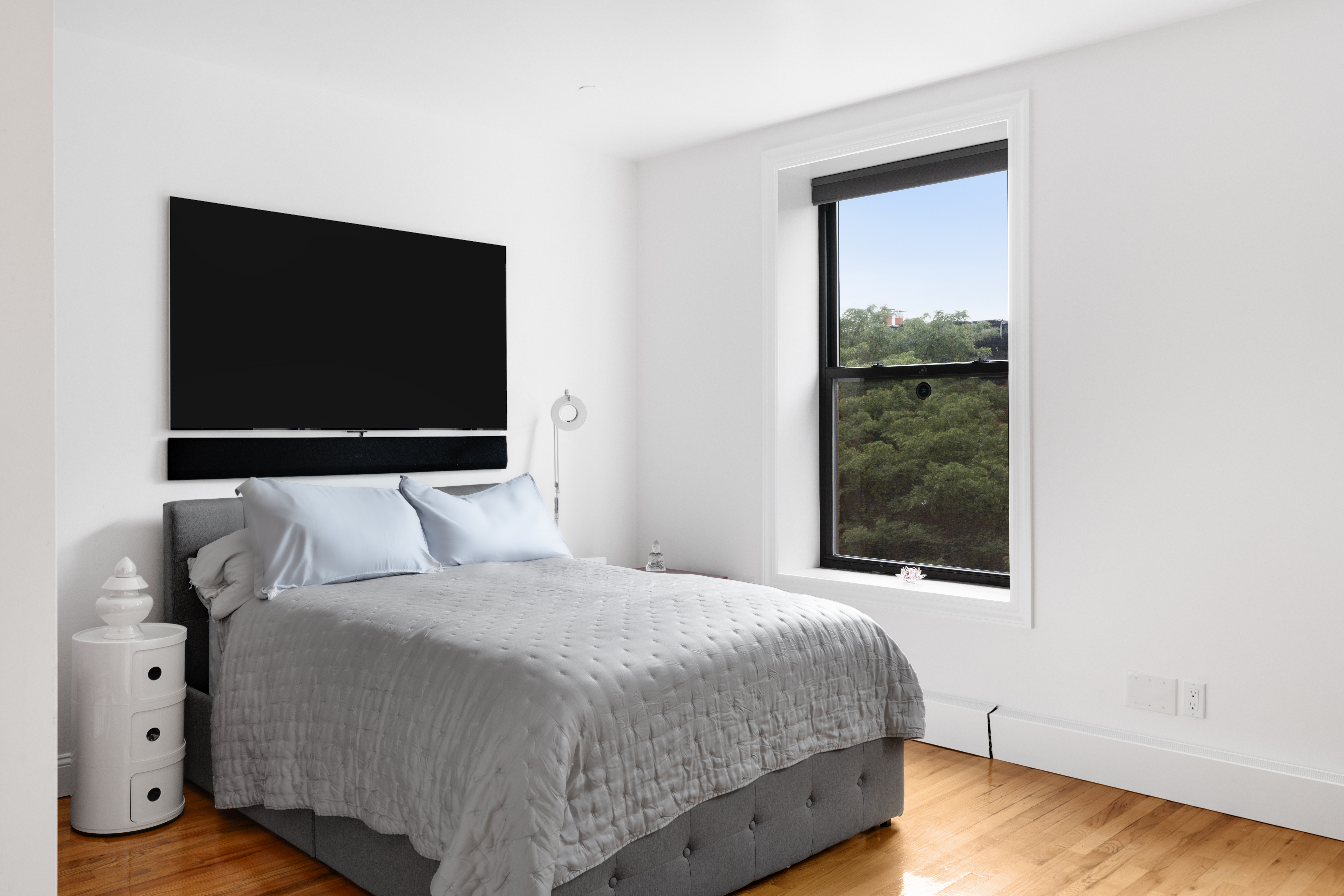 235 West 137th Street, Unit 4F Manhattan, NY 10030 - Photo 5 of 7 a bedroom with a bed and a window