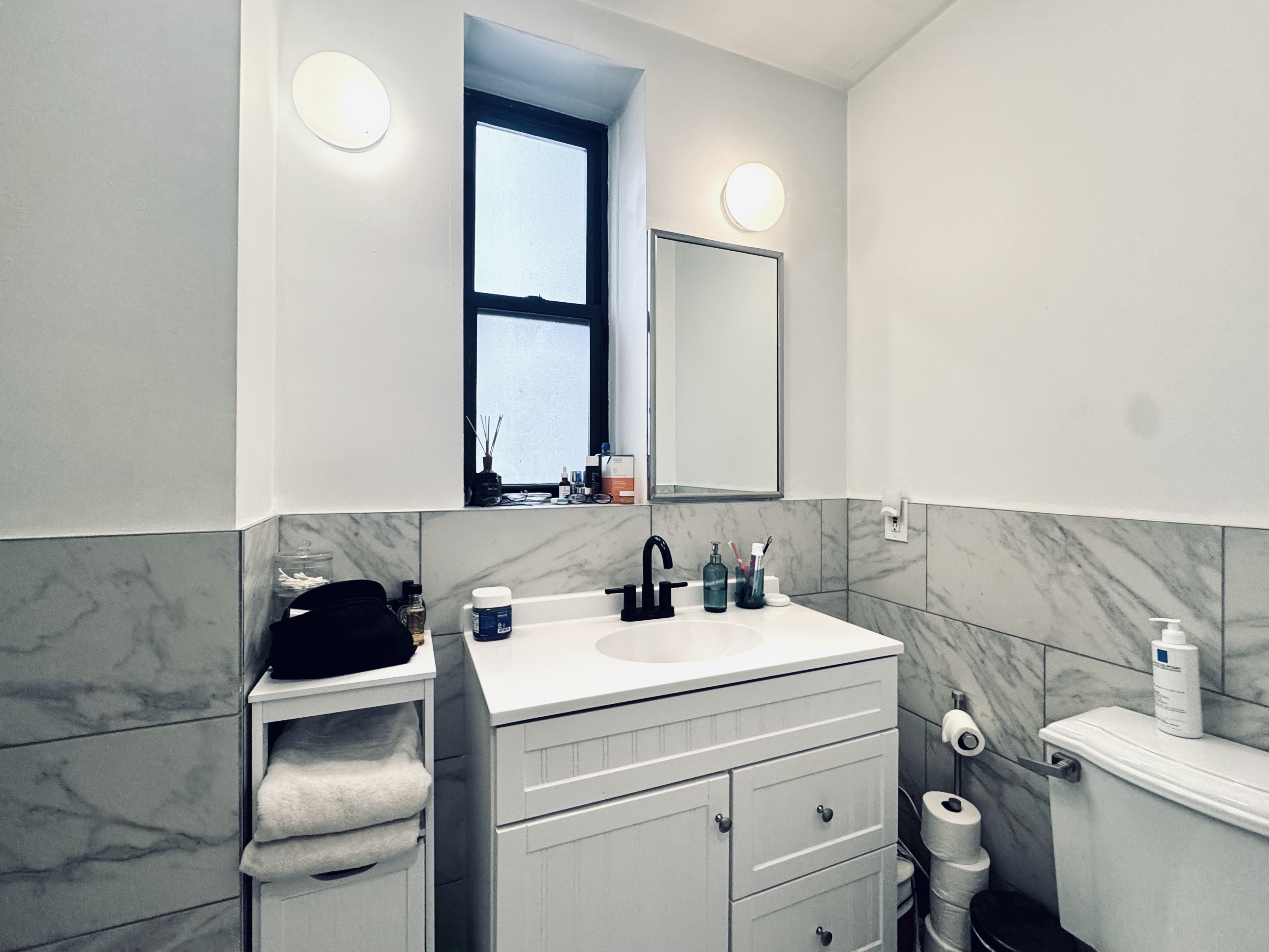 347 5th Avenue, Unit 2R Brooklyn, NY 11215 - Photo 6 of 7 a bathroom with a sink toilet and mirror