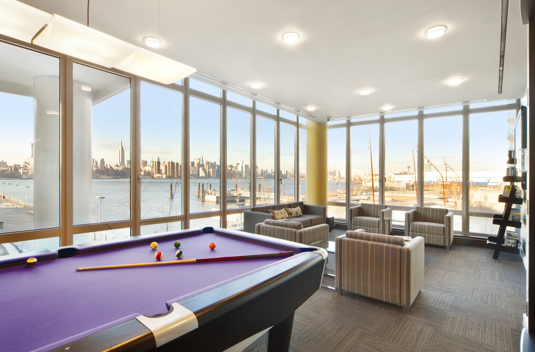 2 Northside Piers, Unit 30Y Brooklyn, NY 11249 - Photo 16 of 22 a living room with furniture city view and large windows