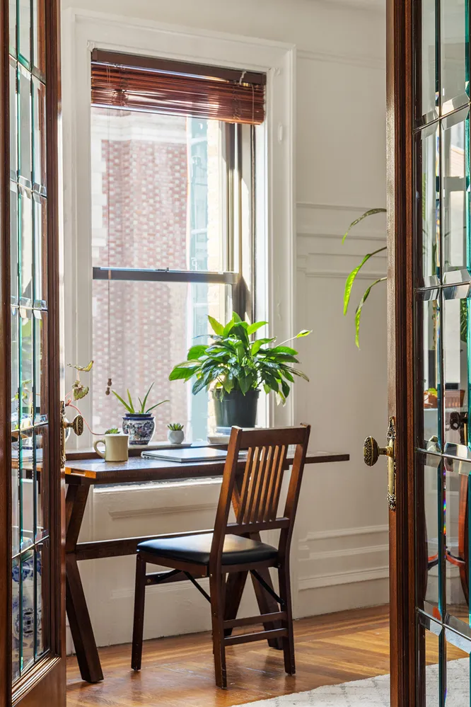 a dining room with furniture and window