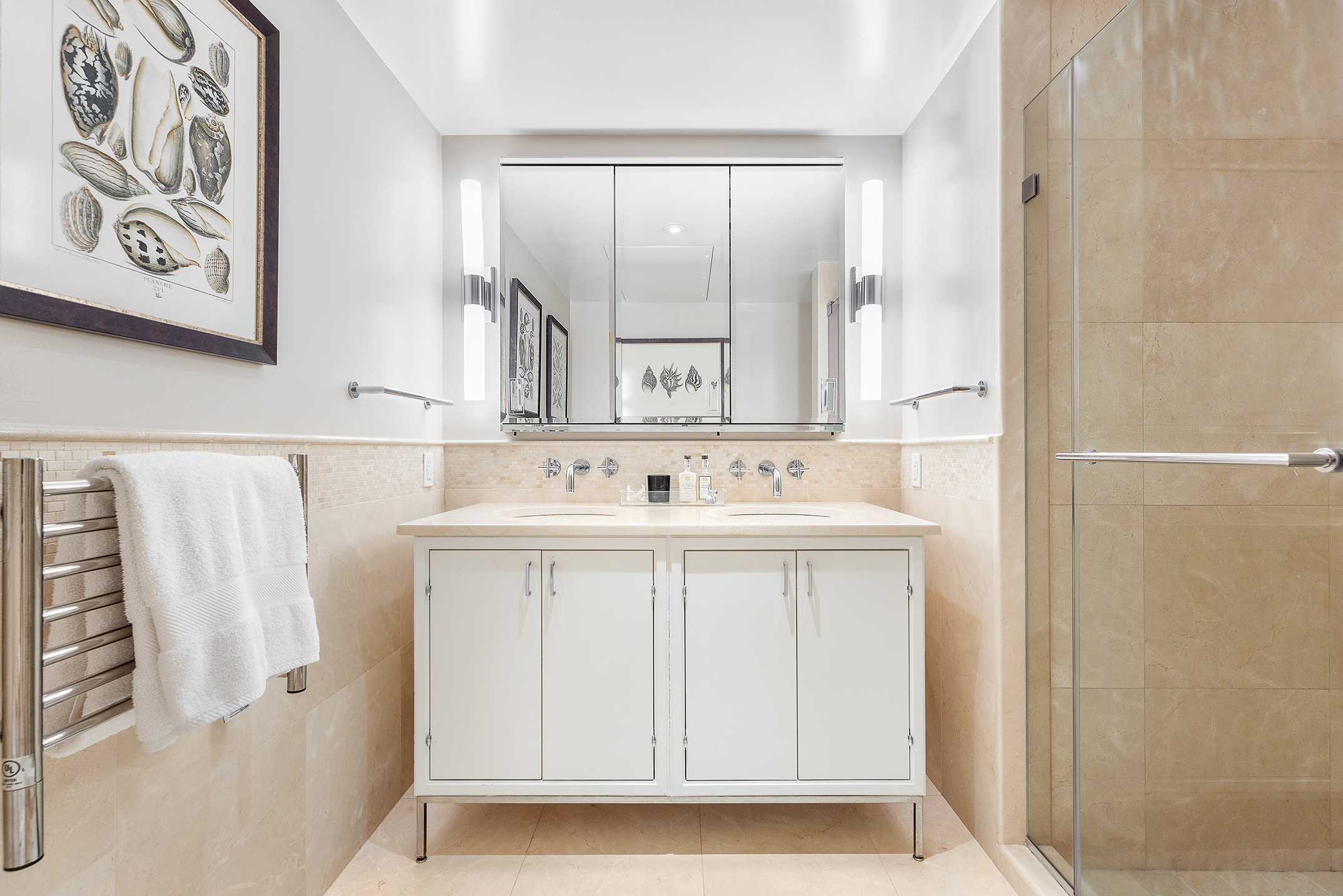 200 East 66th Street, Unit E207 Manhattan, NY 10065 - Photo 7 of 12 a bathroom with a sink a mirror and a shower