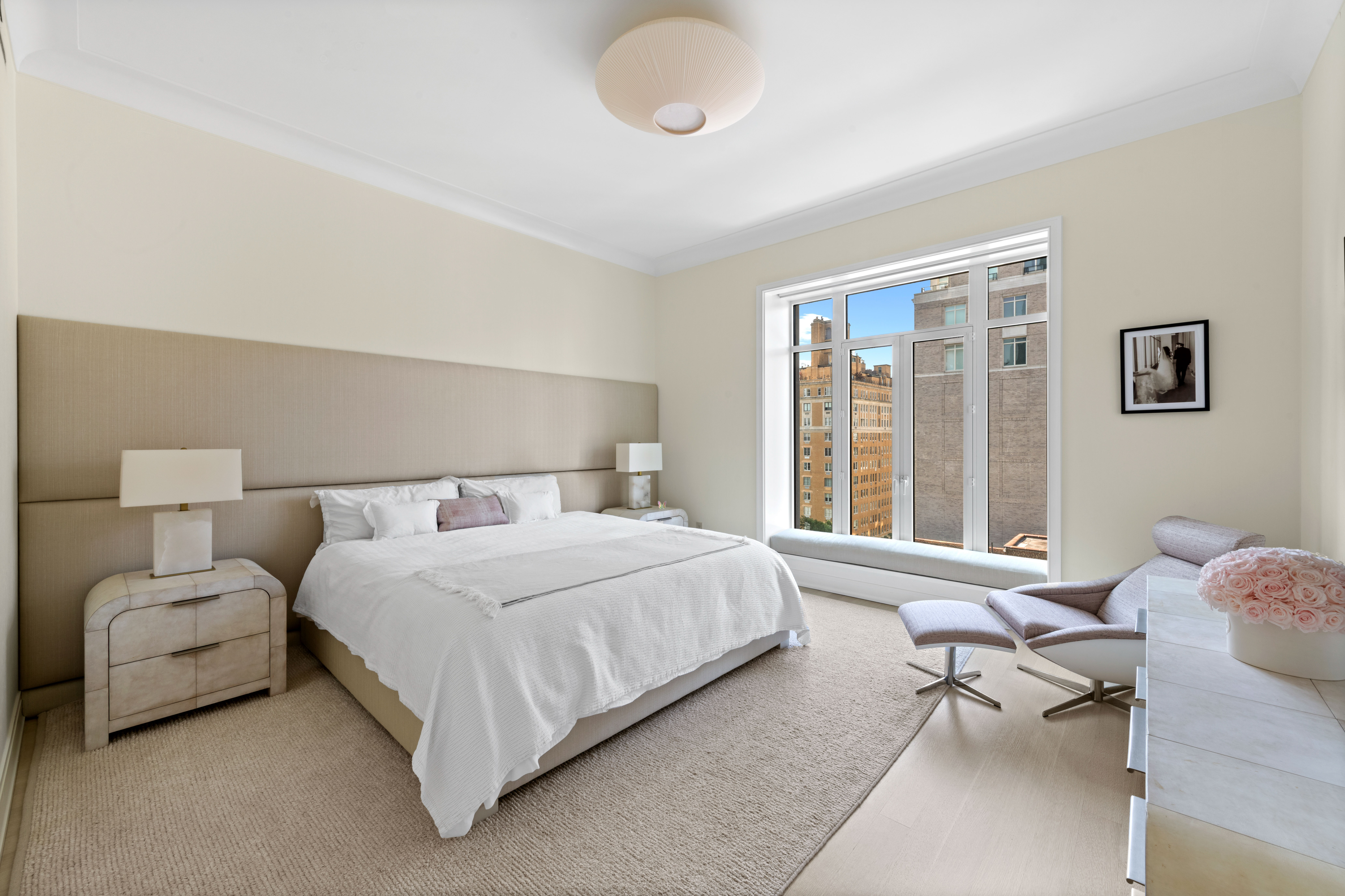 40 East End Avenue, Unit 9B Manhattan, NY 10028 - Photo 6 of 25 a bedroom with a bed and window