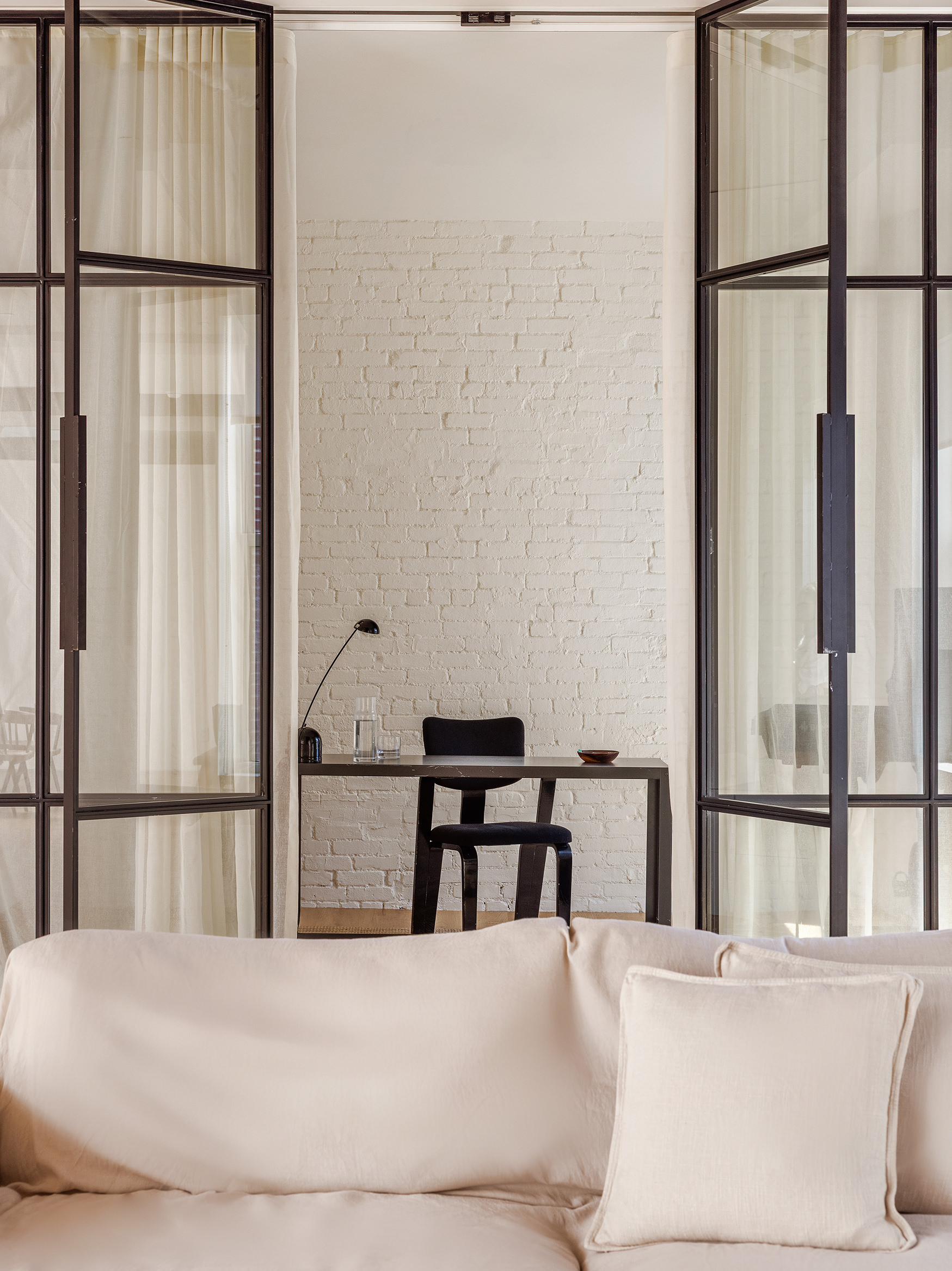 477 Broome Street Manhattan, NY 10013 - Photo 13 of 18 a white bed in a bedroom next to a window