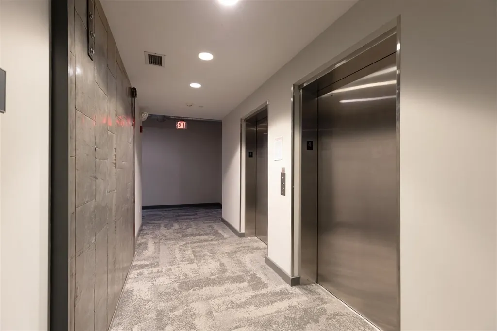 a dining room with furniture and a chandelier