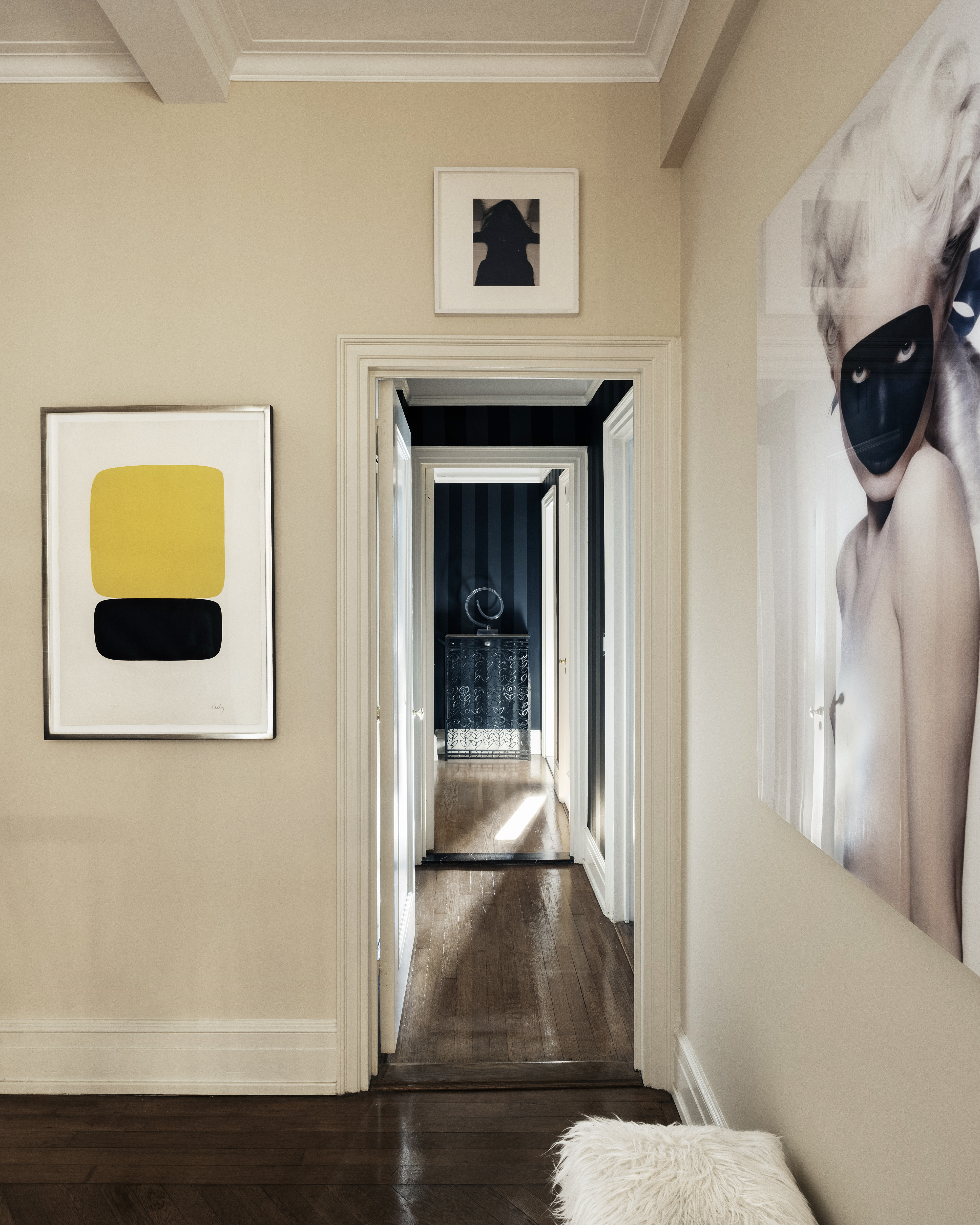 14 East 75th Street, Unit 7E Manhattan, NY 10021 - Photo 7 of 13 a view of a hallway with wooden floor and a living room