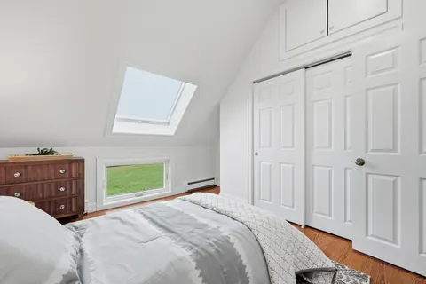 an aerial view of a house with swimming pool garden and outdoor seating