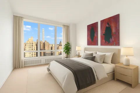 a bedroom with a large bed and a large window