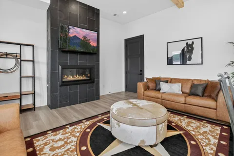 a living room with furniture and a flat screen tv