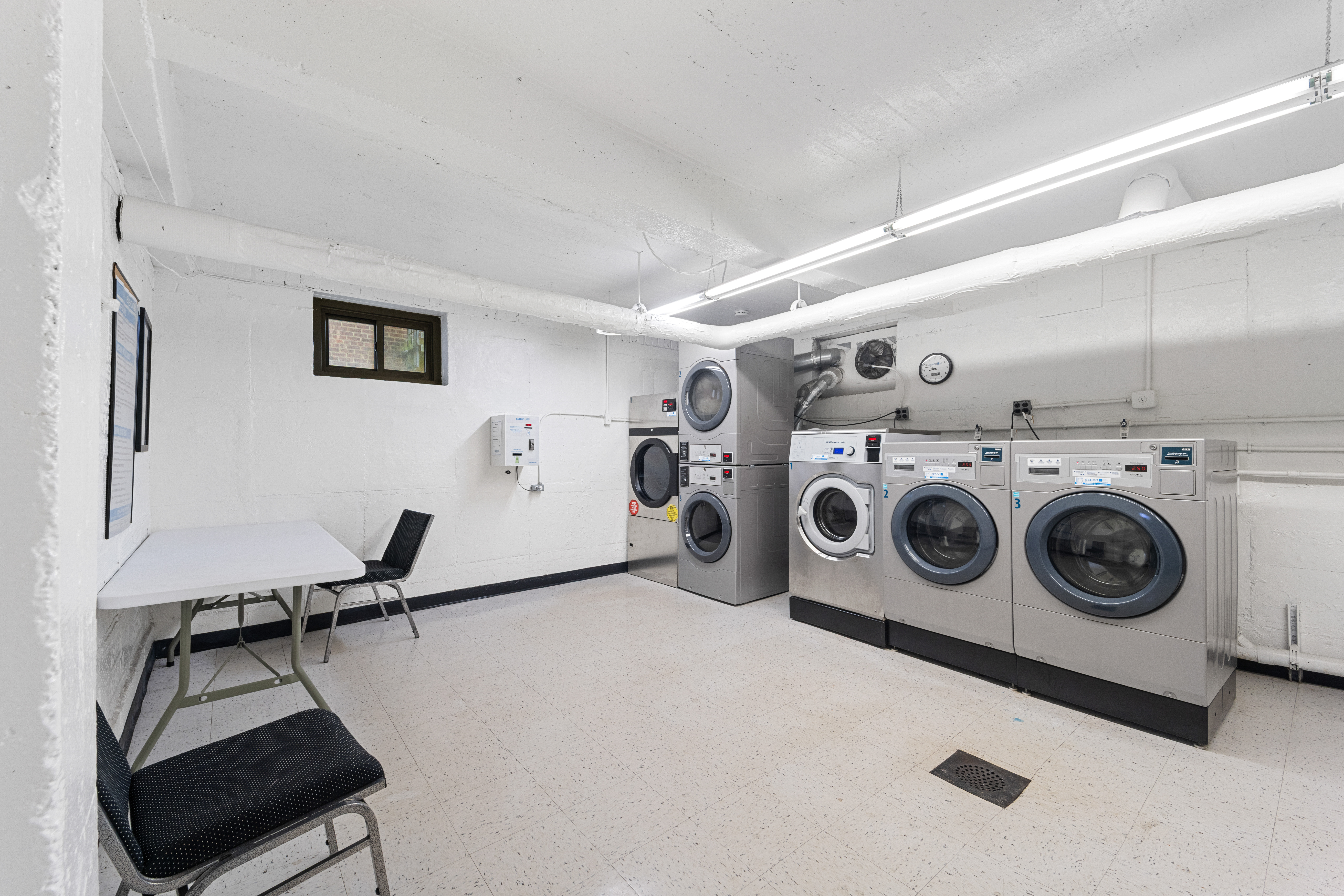 211-01 75th Avenue, Unit 4O Queens, NY 11364 - Photo 18 of 19 a utility room with dryer and washer