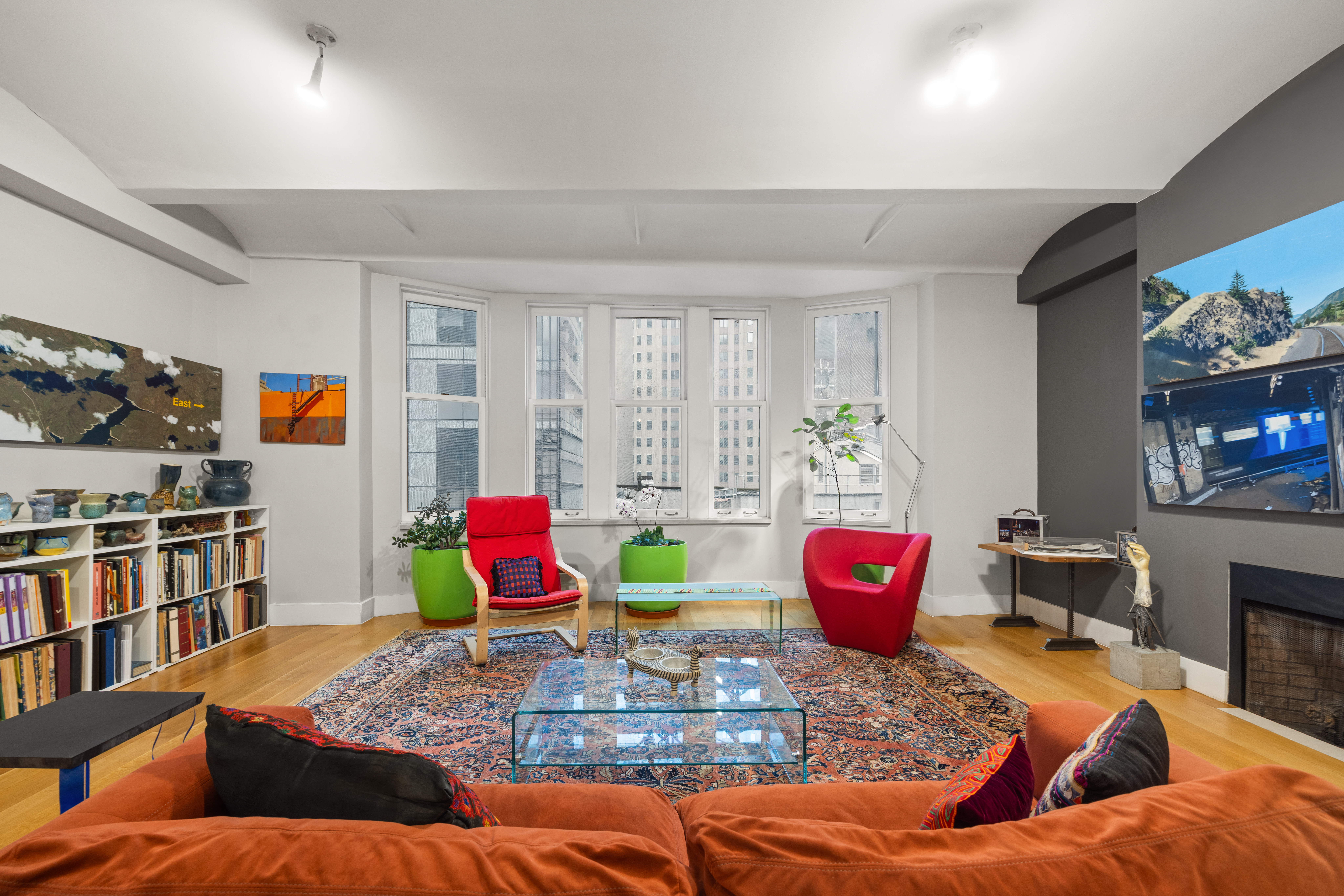 42 Ann Street, Unit 5 Manhattan, NY 10038 - Photo 3 of 16 a living room with furniture and flat screen tv