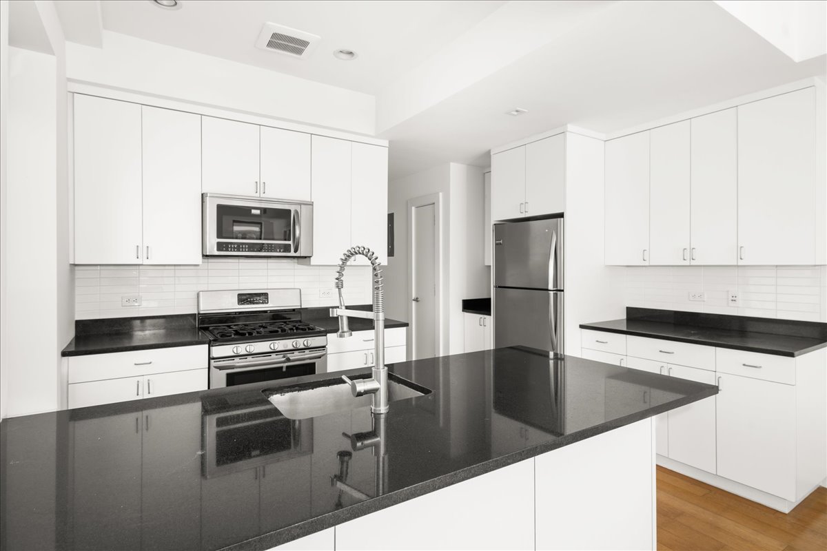 162 Beard Street Brooklyn, NY 11231 - Photo 9 of 20 a kitchen with granite countertop a refrigerator and a sink