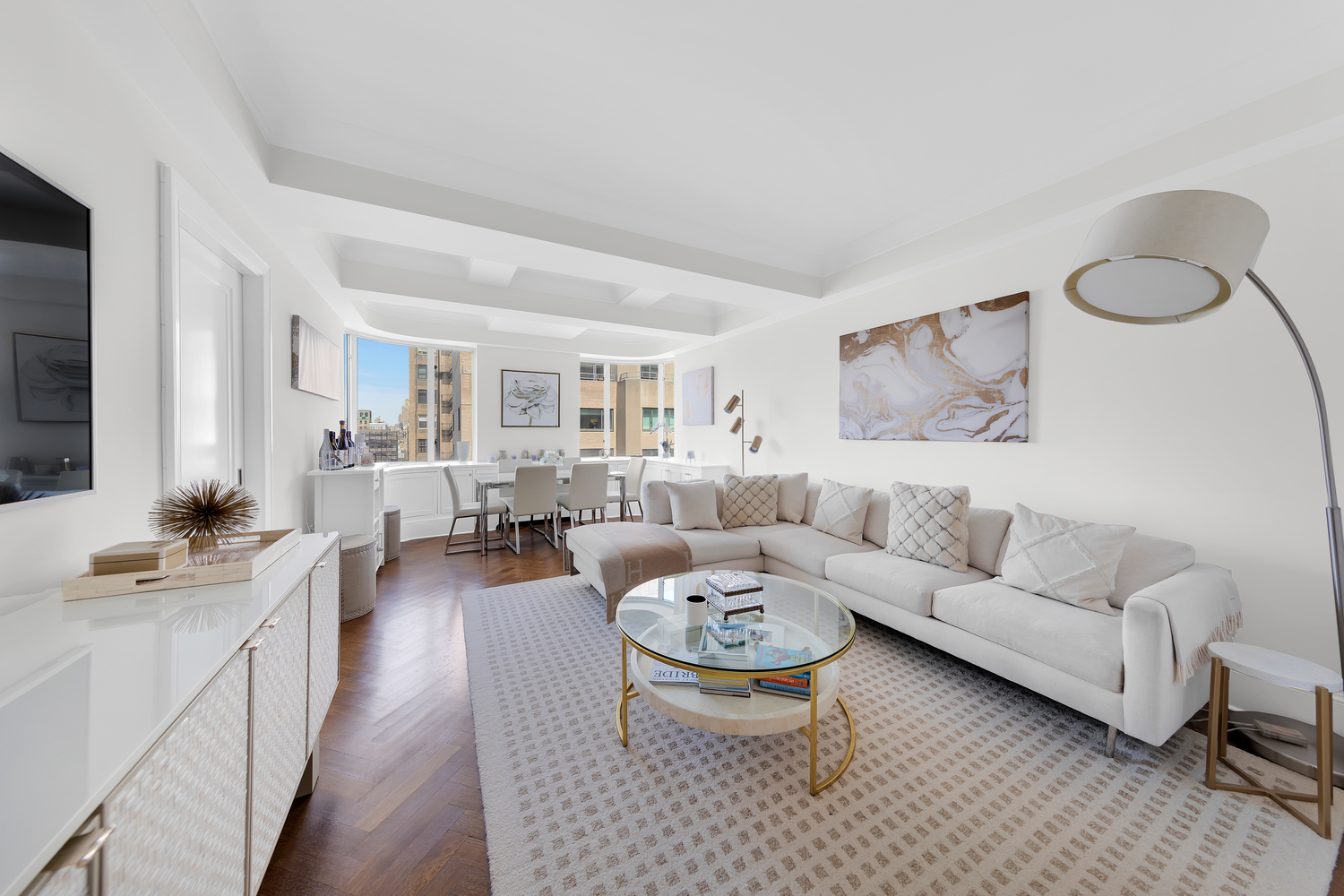 530 Park Avenue, Unit 19G Manhattan, NY 10065 - Photo 1 of 11 a living room with furniture a rug and a window