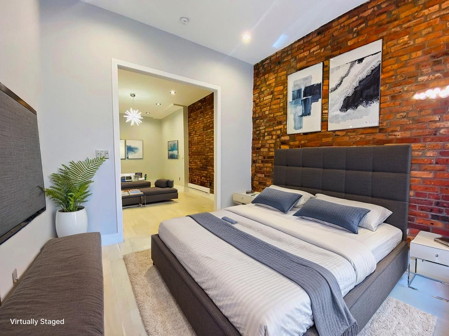133 East 35th Street, Unit 3 Manhattan, NY 10016 - Photo 3 of 16 a bedroom with furniture and a potted plant