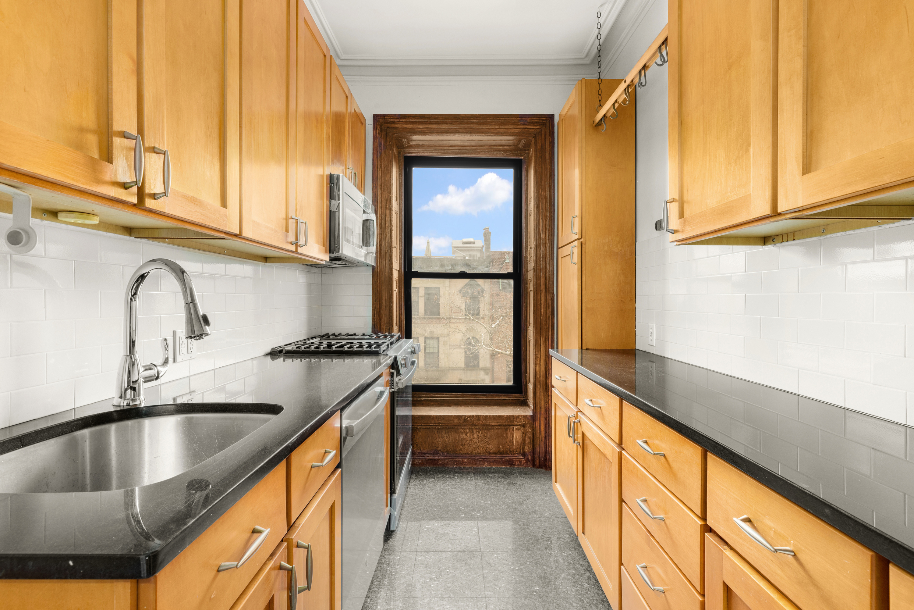 839 Carroll Street, Unit D1 Brooklyn, NY 11215 - Photo 2 of 7 a kitchen with a sink and a window
